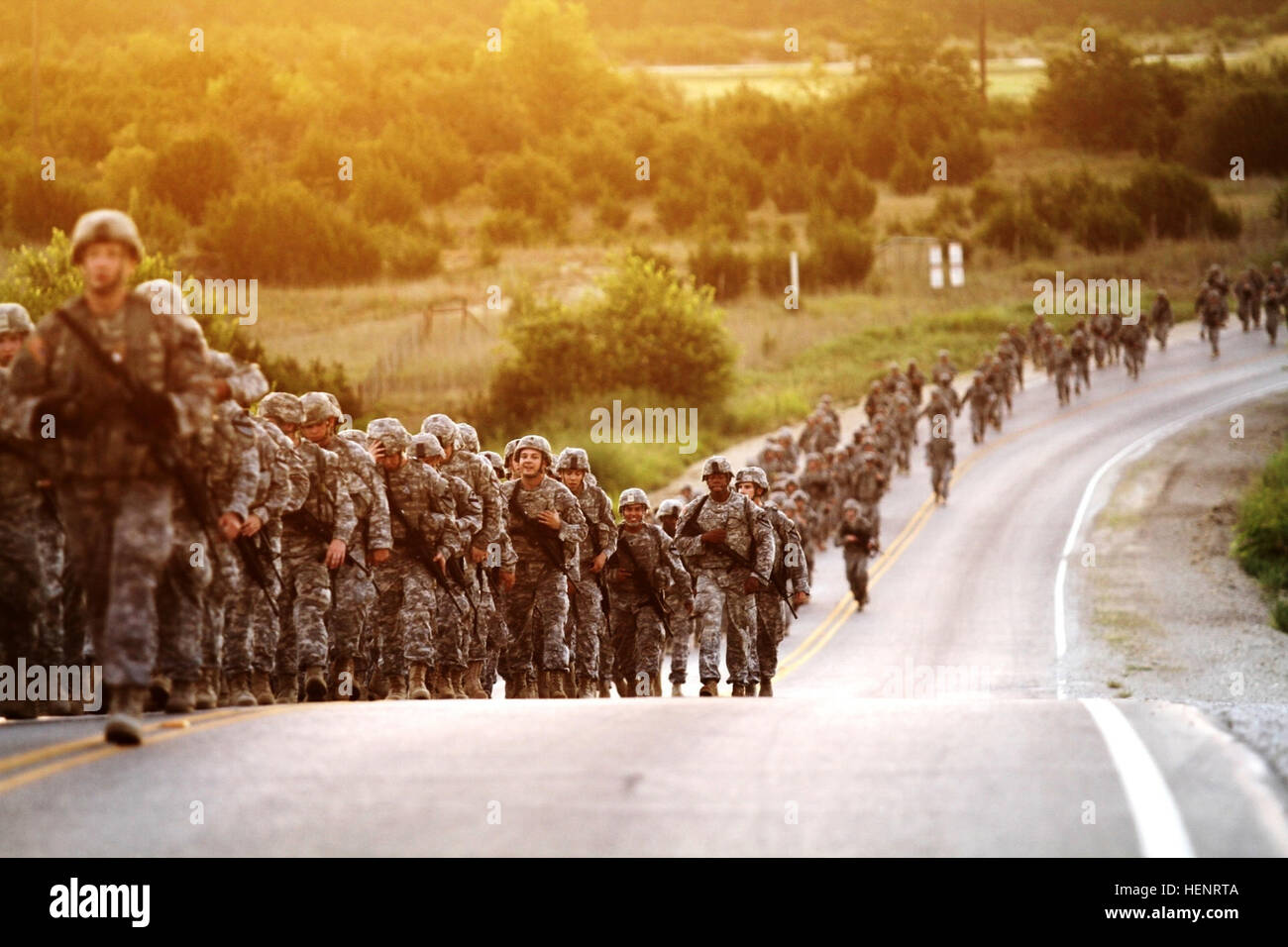 Thousands of Soldiers with the 1st Air Cavalry Brigade, 1st Cavalry Division march up a hill as the sun rises during the brigade’s 9/11 commemoration foot march at Fort Hood, Texas, Sept. 11. The six-mile march was held to honor those who lost their lives that fateful day 13 years ago and to pay tribute to those brave troopers who have sacrificed since for the nation’s freedom. 1st Air Cav executes 9-11 commemoration foot march 140911-A-WD324-019 Stock Photo