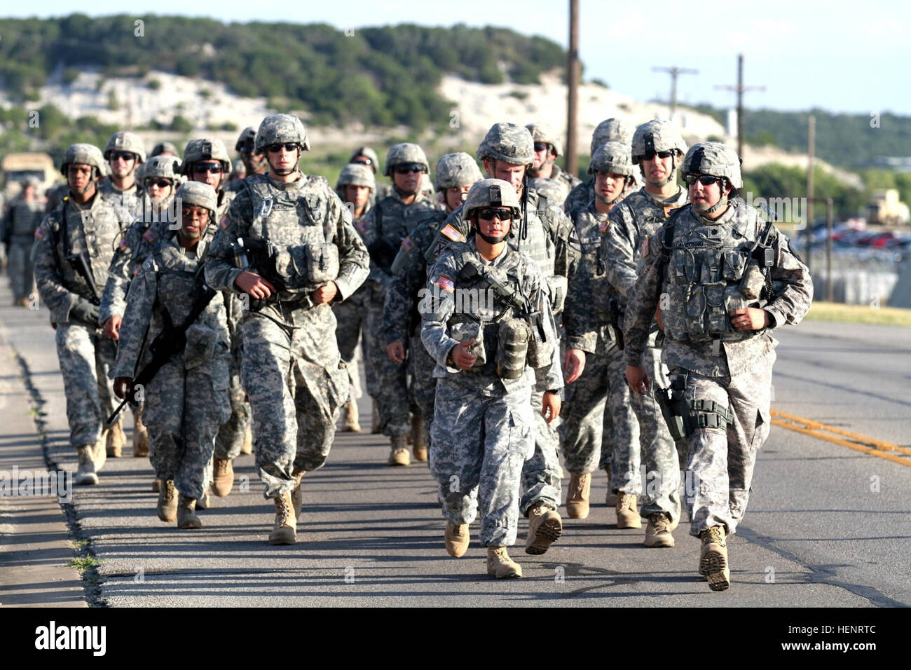 Lt. Col. Anthony Asborno (right), commander for the 3rd Assault Helicopter Battalion, 227th Aviation Regiment, 1st Air Cavalry Brigade, 1st Cavalry Division, leads his Soldiers during the brigade’s 9/11 commemoration foot march at Fort Hood, Texas, Sept. 11. The six-mile march was held to honor those who lost their lives that fateful day 13 years ago and to pay tribute to those brave troopers who have sacrificed since for our nation’s freedom. 1st Air Cav executes 9-11 commemoration foot march 140911-A-WD324-049 Stock Photo