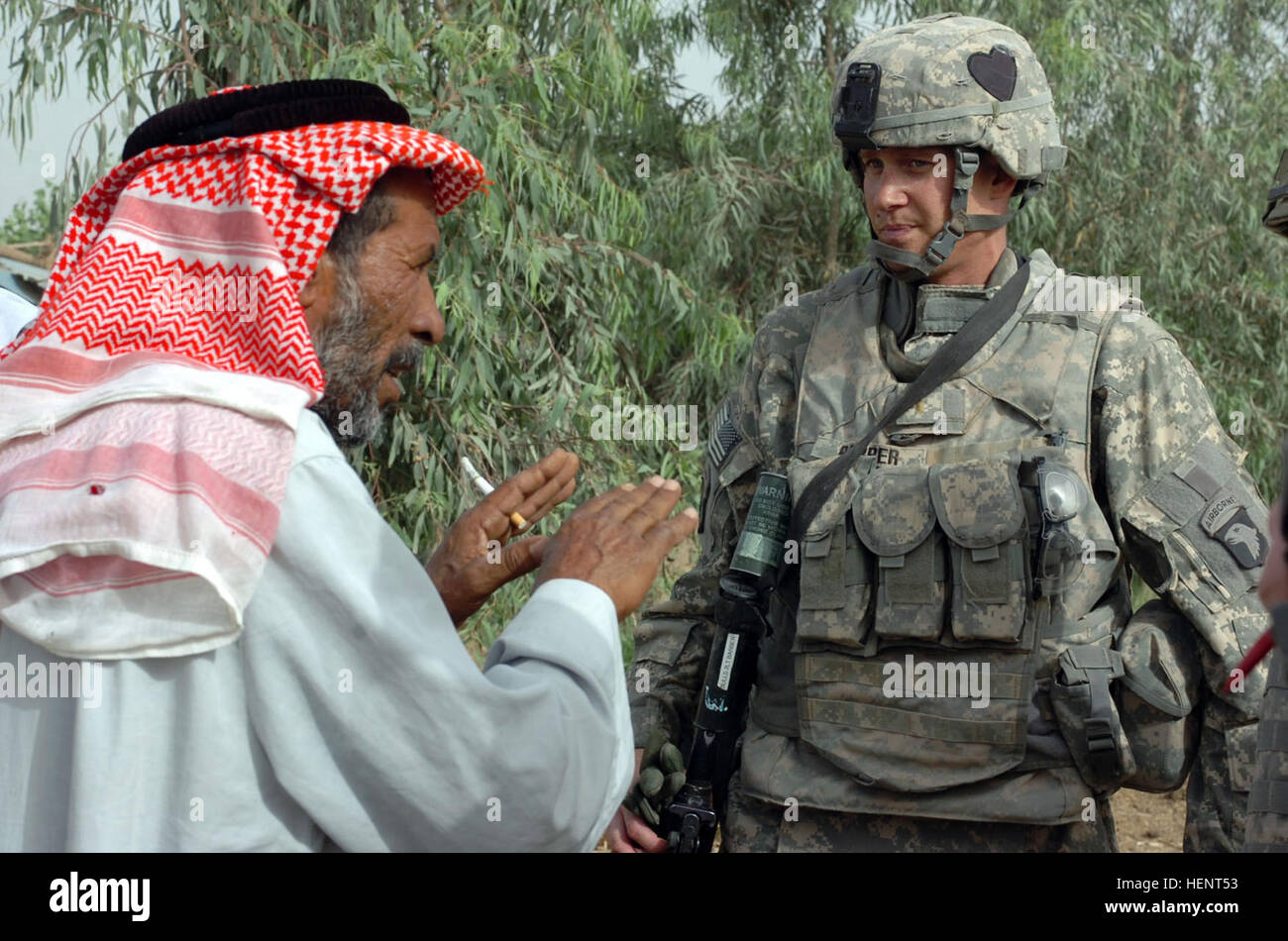 2nd Lt. Vincent Barber, a native of Toledo, Ohio, talks with an Iraqi