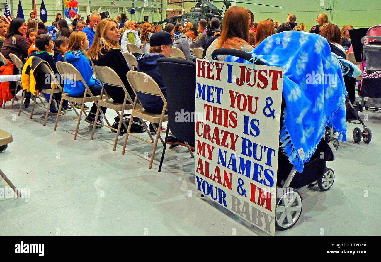 Family members wait to welcome Soldiers assigned to 1st Battalion, 52nd Aviation Regiment home to Fort Wainwright's Hangar 6 upon the unit’s return from a deployment to Afghanistan in support of Operation Enduring Freedom, Sept. 29, 2014. (U.S. Army photo by Capt. Matt Baldwin, USARAK Public Affairs North/Released) Alaska's medevac experts return from war 140929-A-IQ085-310 Stock Photo