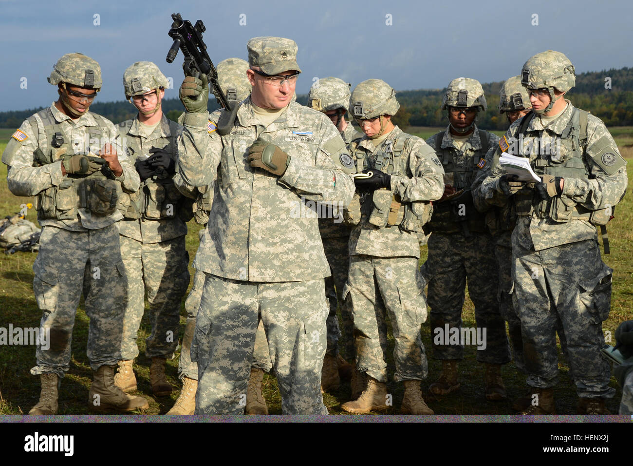 U.S. troopers with 2nd Cavalry Regiment (2CR) receive instructions on how unload and clear the M320 grenade launcher while training for the 2CR Expert Infantryman Badge qualification at the 7th Army Joint Multinational Training Command’s Grafenwoehr Training Area, Germany, Oct. 16, 2014. (U.S. Army photo by Pfc. Nathanael Mercado/Released) 2014 EIB 141016-A-DN311-046 Stock Photo