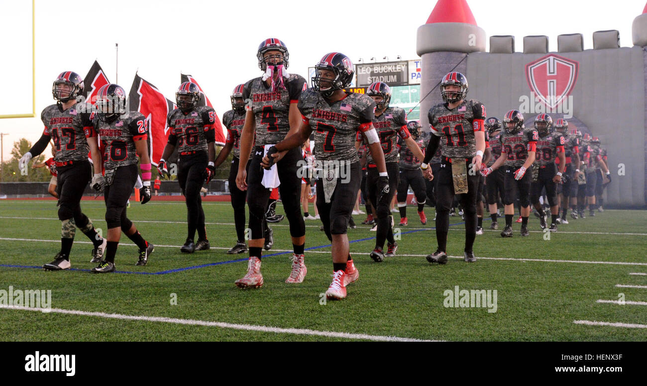 The Harker Heights High School football team marched out of the tunnel in cadence to honor the military during Military Appreciation Night at Killeen High school’s Leo Buckley Stadium in Killeen, Texas, Oct. 16. (U.S. Army photo by Staff Sgt. Johnathan Hoover, 2nd BCT PAO/Released) Cav leaders honored at military appreciation night 141016-A-IU690-094 Stock Photo