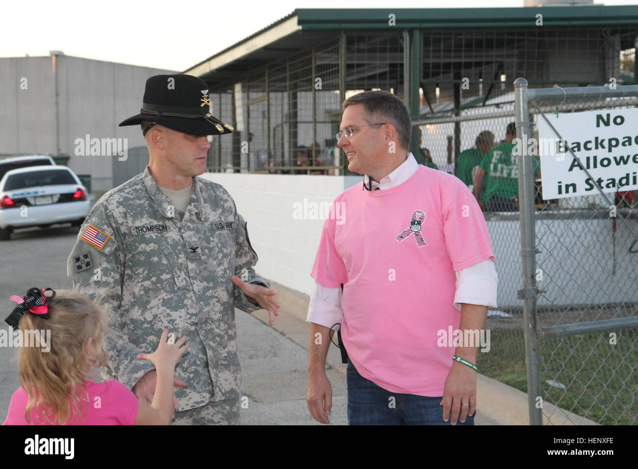 Col. Jeffery Thompson (left), commander of the U.S. Army’s 1st Air Cavalry Brigade, 1st Cavalry Division, speaks with Mark Kincaid (right), Burnet High School’s principal, prior to a high school football game at Burnet, Texas, Oct. 24. Prior to kickoff, Air Cav’s leadership was recognized for their community partnership with the city of Burnet, and the 1st Cav. Div. Horse Detachment presented the national colors and delivered the game ball. First Team honored during high school football game 141024-A-WD324-017 Stock Photo