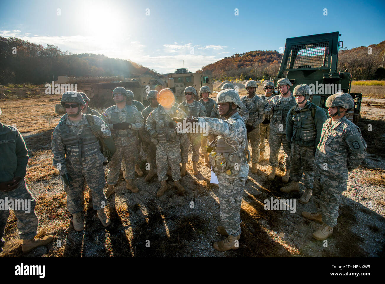 Staff Sgt. Terry Walker, platoon sergeant for the 364th Engineer Platoon (Area Clearance), headquartered in Pine Bluff, Ark., gives instruction to his Soldiers before heading into a training exercise with the M1271 Mine Clearing Vehicle during a weeklong team-oriented course held at Fort Leonard Wood, Missouri, Oct. 30. The M1271, also known as the Medium Flail, is designed to clear through a minefield using a rotating arm with chains and hammers that strike into the ground to destroy or detonate mines. (U.S. Army photo by Sgt. 1st Class Michel Sauret) Army Reserve lays down the hammer, striki Stock Photo