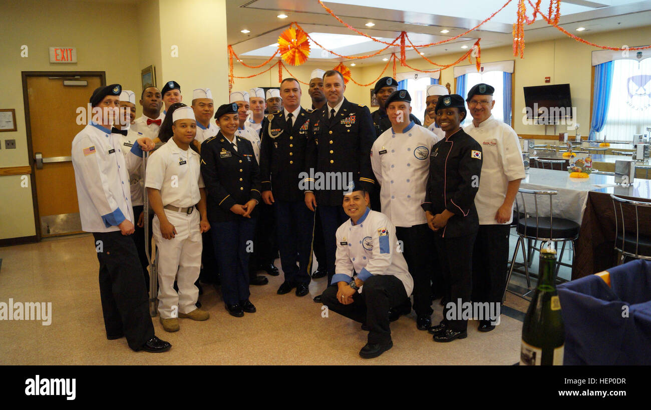 Talon Soldiers who work at the Talon Cafe pose for a photo during the Thanksgiving geast that they prepared for all of the Talon Sodliers and family members on Thanksgiving on Camp Humphreys. Fueling Soldiers 141127-A-TU438-066 Stock Photo