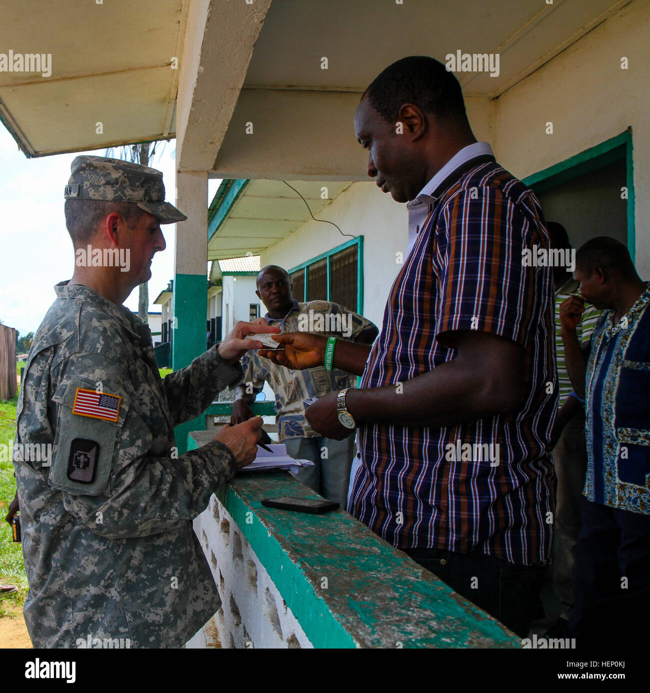 Colonel Patrick Garman, left, commander of the 1st Area Medical