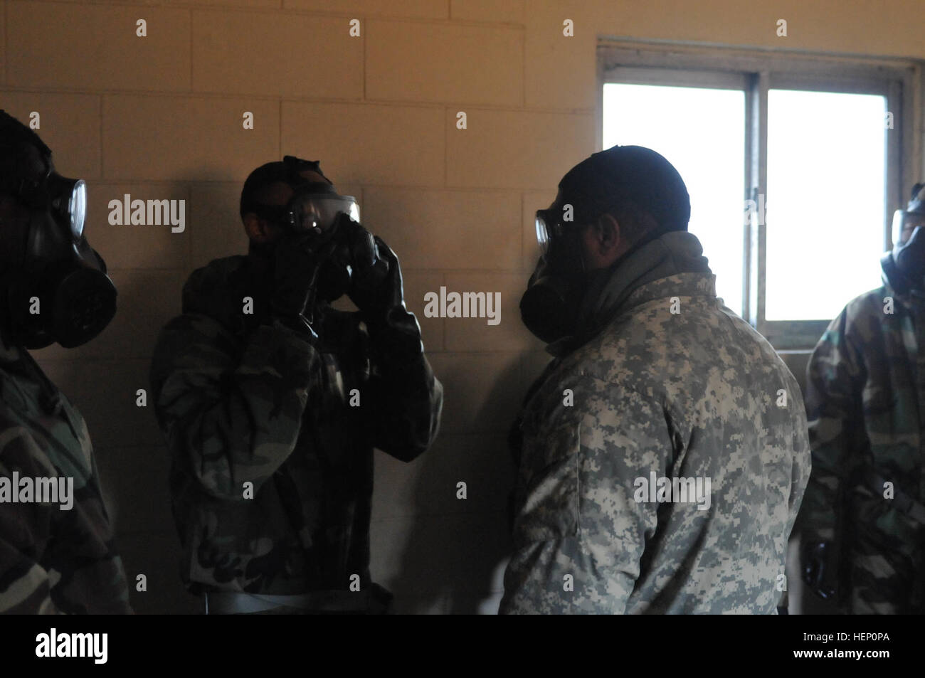 Staff Sgt. Lionel Abrams, a native of Richmond, Va., the brigade Chemical Biological, Radiological and Nuclear noncommissioned officer, assigned to Headquarters and Headquarters Battery, 210th Field Artillery Brigade, conducts CS gas chamber training Dec. 5, 2014, on Camp Casey, South Korea. (U.S. Army photo by Cpl. Song Gun-woo, 210 FA BDE PAO) Dirty jobs %%%%%%%%E2%%%%%%%%80%%%%%%%%93 CBRN specialist 141205-A-IV618-942 Stock Photo