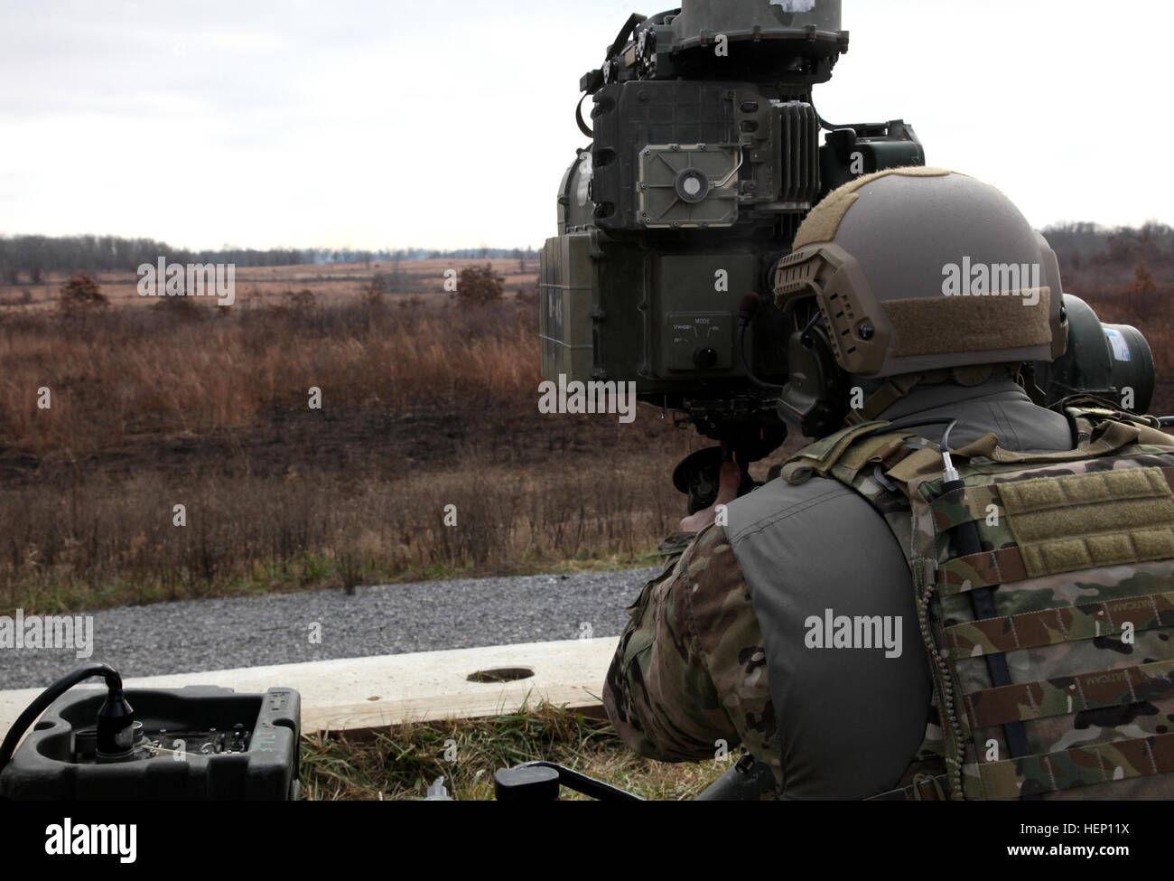 A Special Forces Soldier with the 5th Special Forces Group (Airborne), looks through the optics of a BGM-71 Tube-launched, Optically-tracked, Wire-guided missile, Dec. 9, 2014, prior to firing, during a TOW missile live fire exercise. (U.S. Army photo by Spc. Alexis Concepcion, 5th SFG(A) Combat Camera) Legion, Bastogne conduct TOW missile training 141209-A-MU345-026 Stock Photo