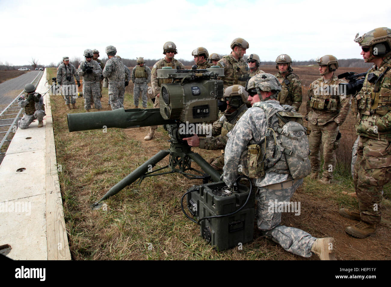 A Special Forces Soldier with the 5th Special Forces Group (Airborne), looks through the optics of a BGM-71 Tube-launched, Optically-tracked, Wire-guided missile, Dec. 9, 2014, prior to firing, during a TOW missile live fire exercise. (U.S. Army photo by Spc. Alexis Concepcion, 5th SFG(A) Combat Camera) Legion, Bastogne conduct TOW missile training 141209-A-MU345-030 Stock Photo