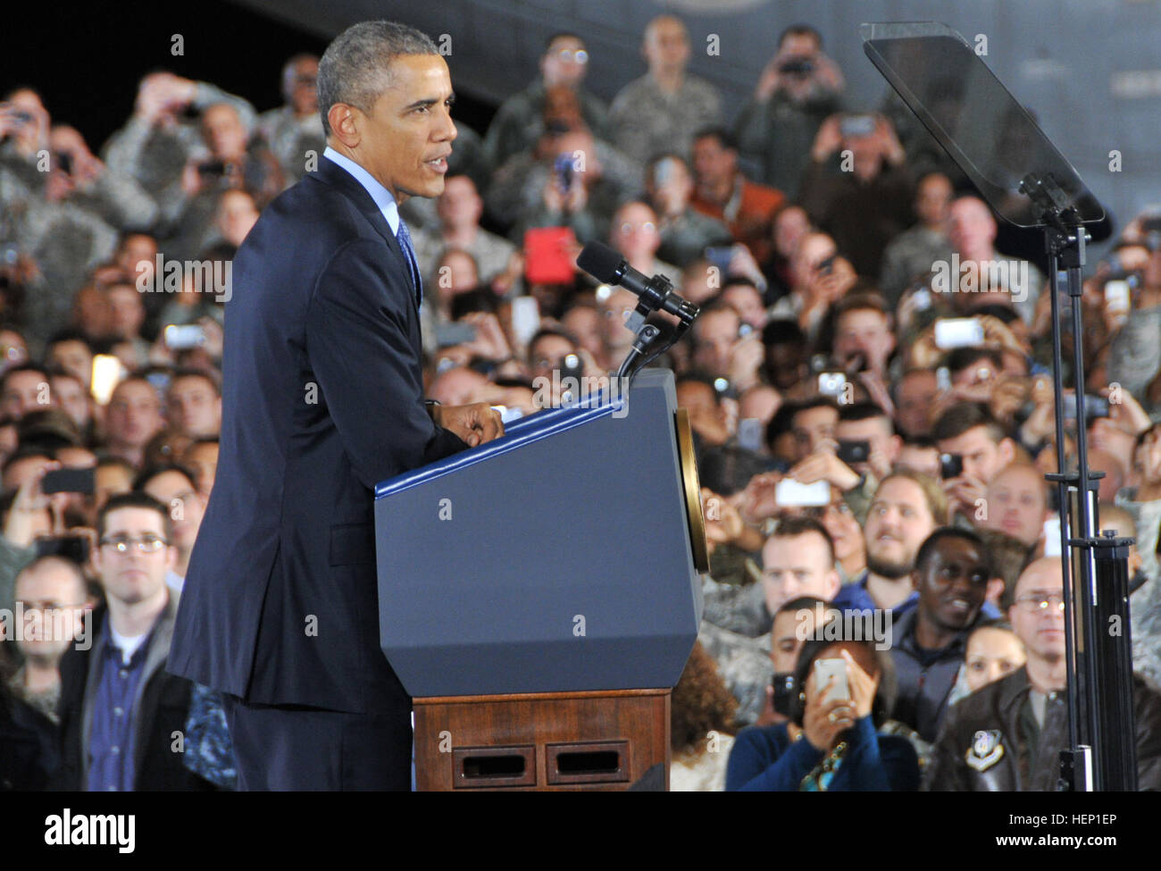 U.S. President Barack Obama speaks to an audience of 3,000 service members, military families, civic leaders and elected officials Dec. 15 inside a U.S. Marine hangar on Joint Base McGuire-Dix-Lakehurst, N.J. The purpose of the president’s visit to JB MDL was to thank troops for their service. Also speaking at the event were Maj. Gen. Margaret W. Boor, commanding general of the Army Reserve’s 99th Regional Support Command, and Maj. Gen. Rick Martin, commanding general of the U.S. Air Force Expeditionary Center. President Obama thanks troops at New Jersey's Joint Base MDL 141215-A-VX676-026 Stock Photo