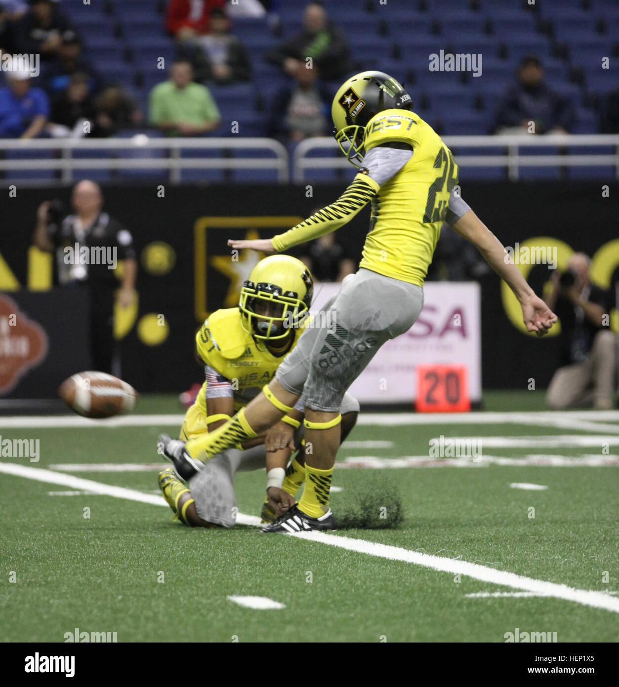 Players from the East and West teams entertain the crowd with an action-packed, high-scoring grudge match at the Alamodome in San Antonio, Jan. 3, 2015. The West team won this year’s contest 39-36. Held annually since 2001, the Army All-American Bowl brings 96 of the nation’s top high school football players and 125 of the top high school band students together for one week to showcase their skills and represent the Army. Soldier mentors from the Army and Army Reserve stay with All-American players for a week prior to the game to teach players Army values: Loyalty, duty, respect, selfless serv Stock Photo