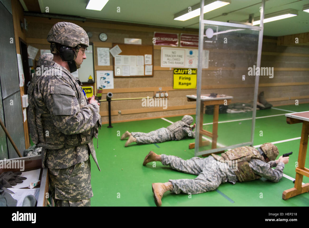 U.S. Army Sgt. Seth Maxwell, standing, assigned to Headquarters and