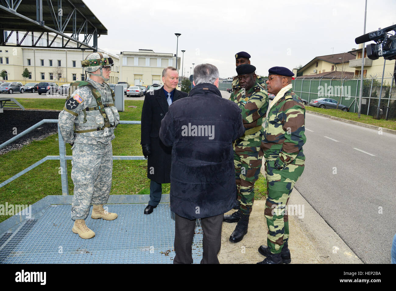 Ivano Trevisanutto, chief, Training Support Center Italy; James V. Matheson, chief, Regional Training Support Division South, brief the Deployable Instrumentation System (DISE) in English and French, during the visit of Brig. Gen. Cheikh Gueye, Senegalese chief of army staff. DISE is a system that uses lasers, GPS and computers to detect and track hits from weapons for realistic combat training. The seminar was intended as a forum for attendees to share their experiences in supporting coalition and combatant commanders in a joint task force environment. (Photos by U.S. Army Visual Information  Stock Photo