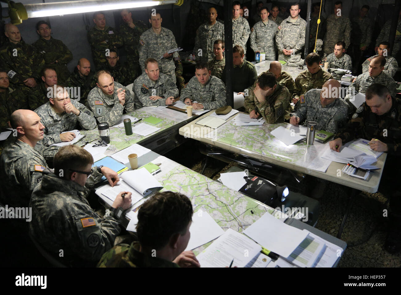 U.S. Soldiers of 2nd Cavalry Regiment lead a mission brief during exercise Allied Spirit I at the Joint Multinational Readiness Center in Hohenfels, Germany, Jan. 21, 2015. Exercise Allied Spirit includes more than 2,000 participants from Canada, Hungary, Netherlands, United Kingdom, and the U.S. Allied Spirit is exercising tactical interoperability and testing secure communications within alliance members. (U.S. Army photo by Spc. Tyler Kingsbury/Released) Allied Spirit I 150121-A-LO967-001 Stock Photo
