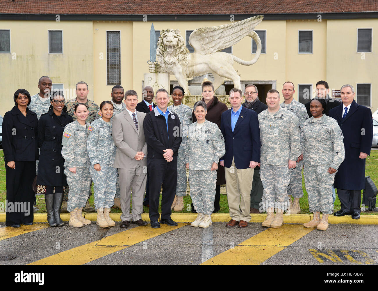 Col. Frances A. Hardison, colonel of Programs and Policy United States Army Africa, with Soldiers and civilians pose for a group photo in front of the USARAF commander's office at Caserma Ederle in Vicenza, Italy, Jan. 23, 2015. (Photo by U.S. Army Visual Information Specialist Davide Dalla Massara) Col. Frances A. Hardison with Soldiers, civilians pose for group photo 150123-A-DO858-001 Stock Photo