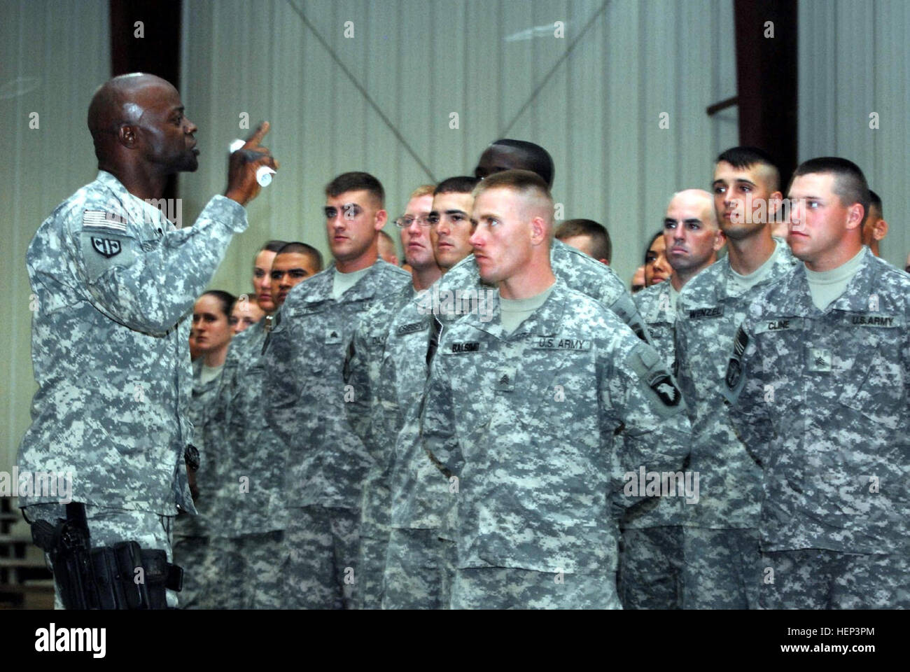 Command Sgt. Maj. Bernard McPherson, native of Orangeburg, S.C., and command sergeant major of the 18th Military Police Brigade addresses seventy-four newly inducted non-commissioned officers of the 716th Military Police Battalion, 18th MP Bde., Multi-National Division-Baghdad, into the Corps of NCOs June 21 at Camp Liberty during a NCO induction ceremony. The 716th MP Bn. is deployed from Fort Campbell, Ky. Maintaining the standard in Iraq 96055 Stock Photo