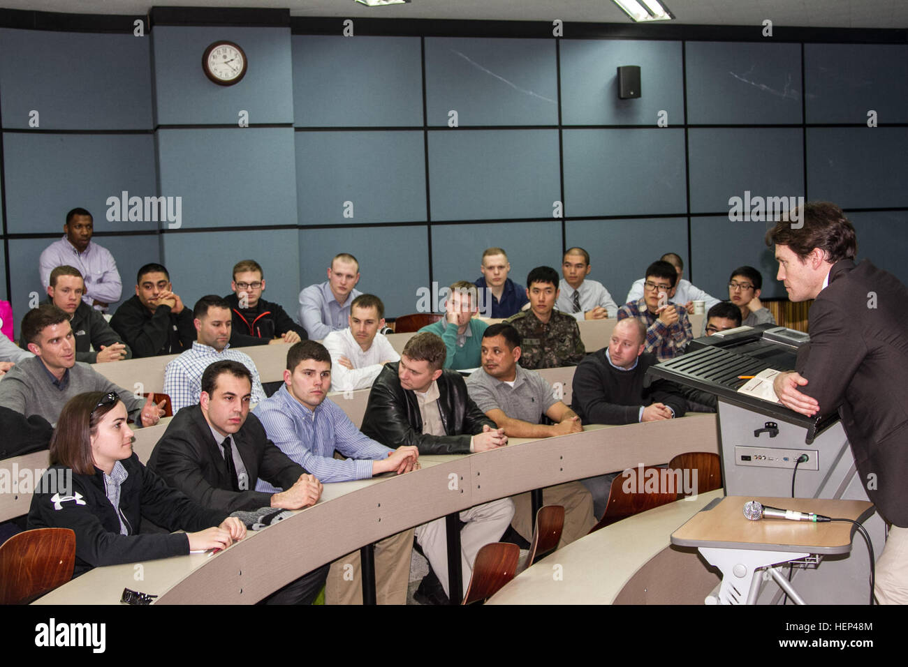 A 3-2 General Support Aviation Soldier discusses the topics during the seminar at the Yonsei University with Professor John  Delury, students and other Soldiers. Shared learning and understanding 150205-A-TU438-576 Stock Photo