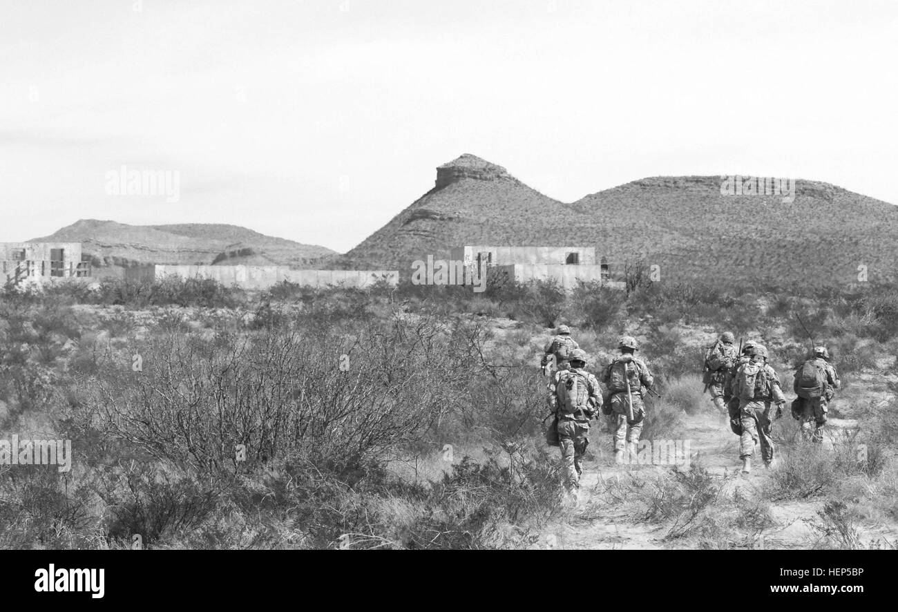 Infantrymen from 4th Battalion, 17th Infantry Regiment, 1st Stryker Brigade Combat Team, 1st Armored Division, Fort Bliss, Texas, head out to the village during a platoon live fire exercise at Malakhand Live Fire Village, Oro Grande, N.M., Feb. 24, 2015. (U.S. Army photo by Spc. Maricris C. Cosejo) %%%%%%%%E2%%%%%%%%80%%%%%%%%98Buffalos%%%%%%%%E2%%%%%%%%80%%%%%%%%99 strengthen lethal platoons, combat power 150224-A-ZR018-393 Stock Photo