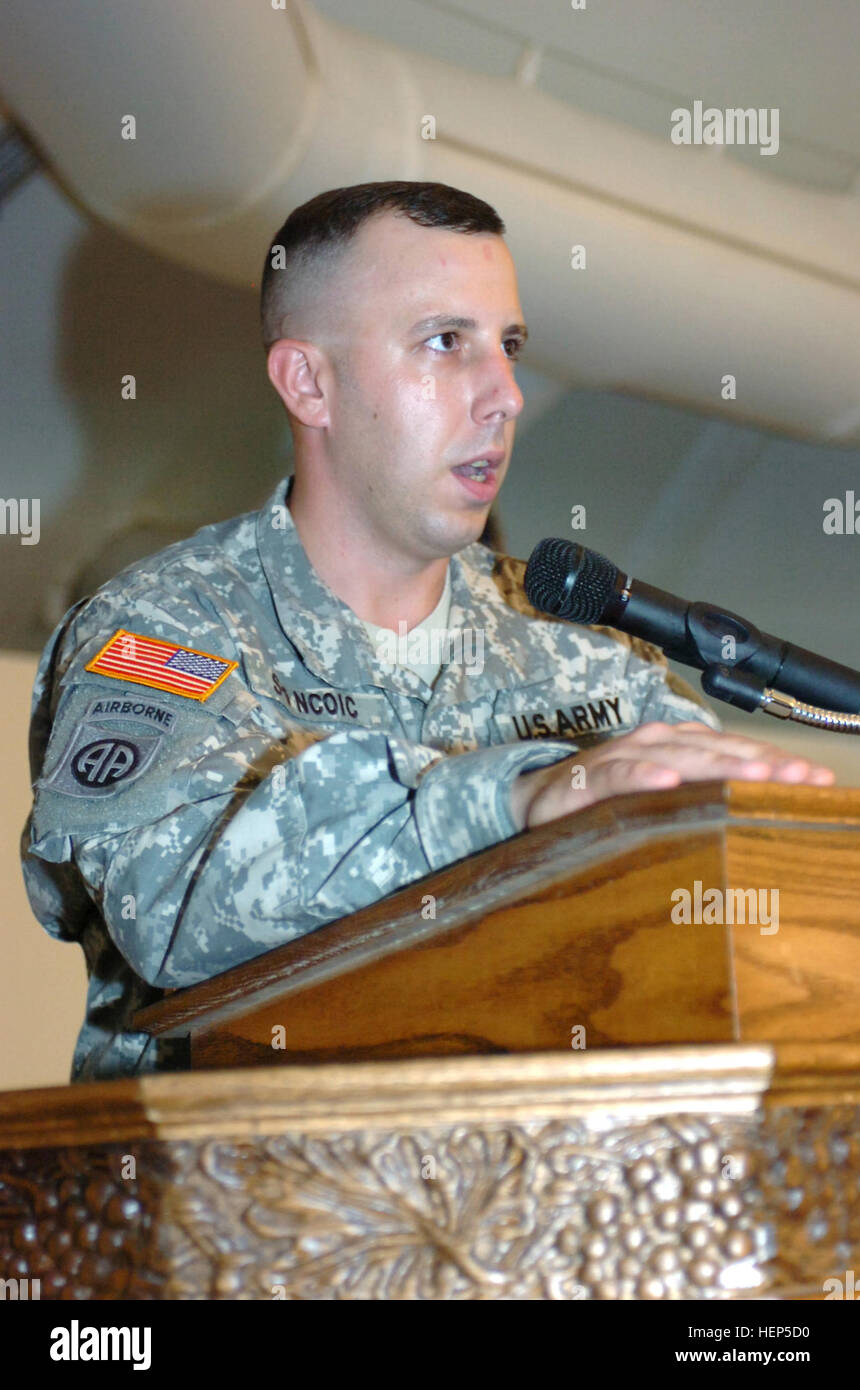 GUANTANAMO BAY, Cuba – Army Staff Sgt. Joseph Lobban, the resident emcee for the 525th Military Police Battalion, mans the microphone for the battalion’s End of June Ceremony at Trooper’s Chapel here, June 30, 2008. The ceremony, which is held monthly, honors exceptional and recently promoted Troopers. JTF Guantanamo conducts safe and humane care and custody of detained enemy combatants. The JTF conducts interrogation operations to collect strategic intelligence in support of the Global War on Terror and supports law enforcement and war crimes investigations. JTF Guantanamo is committed to the Stock Photo