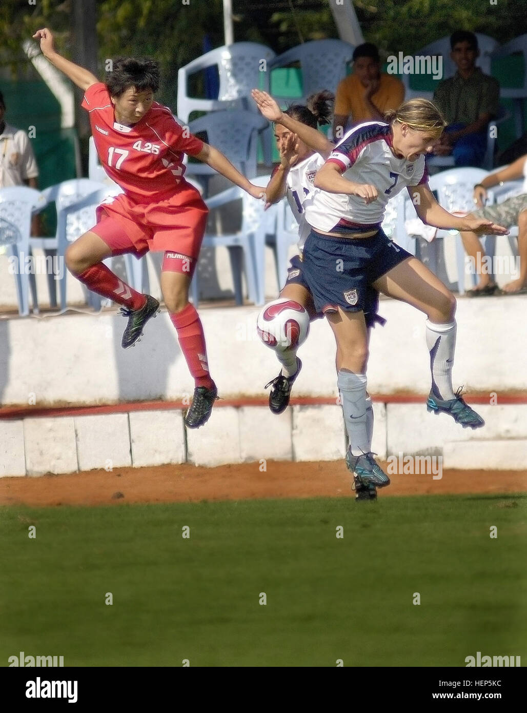 North Korean People's Army 1st Lt. Ill Ok Jang, and U.S. Army Capt. Emily Nay and U.S. Air Force Capt. Wendy Emminger scramble for the ball during a CISM match Stock Photo