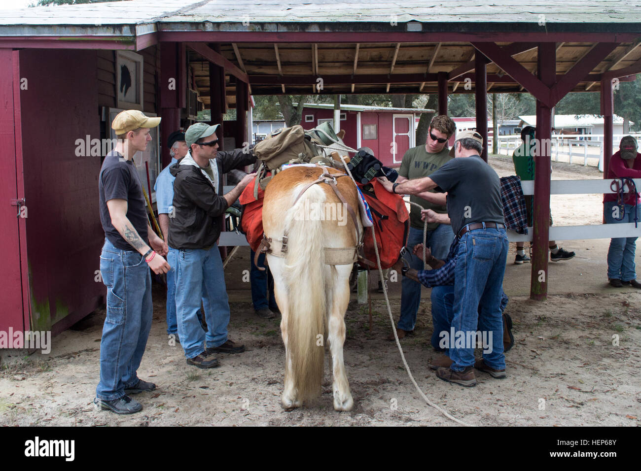 A member of the Eglin Air Force Base Sand and Spur Riding Club, right