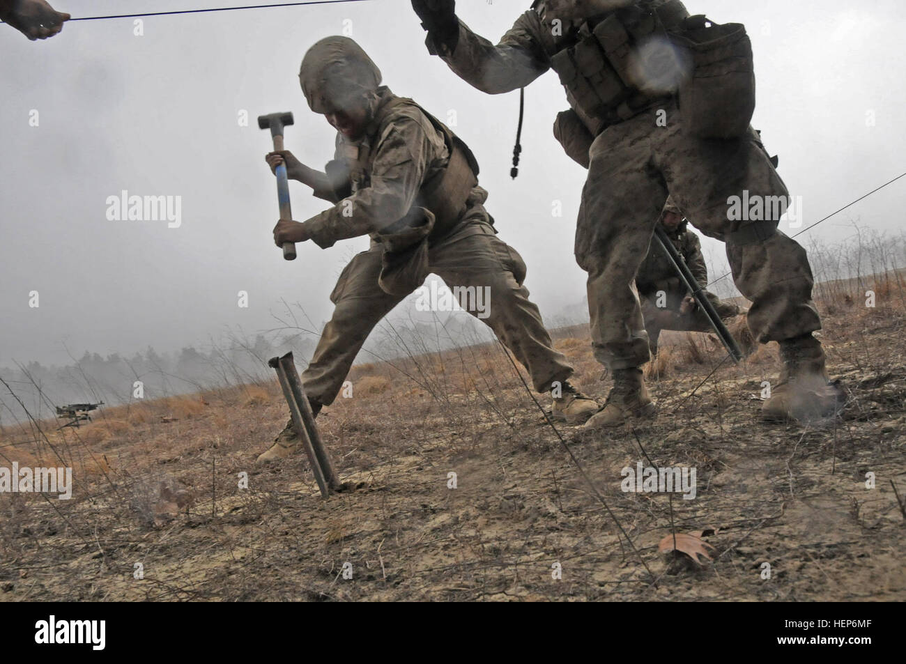 Marines with Bravo Battery, 1st Battalion, 10th Marine Regiment quickly