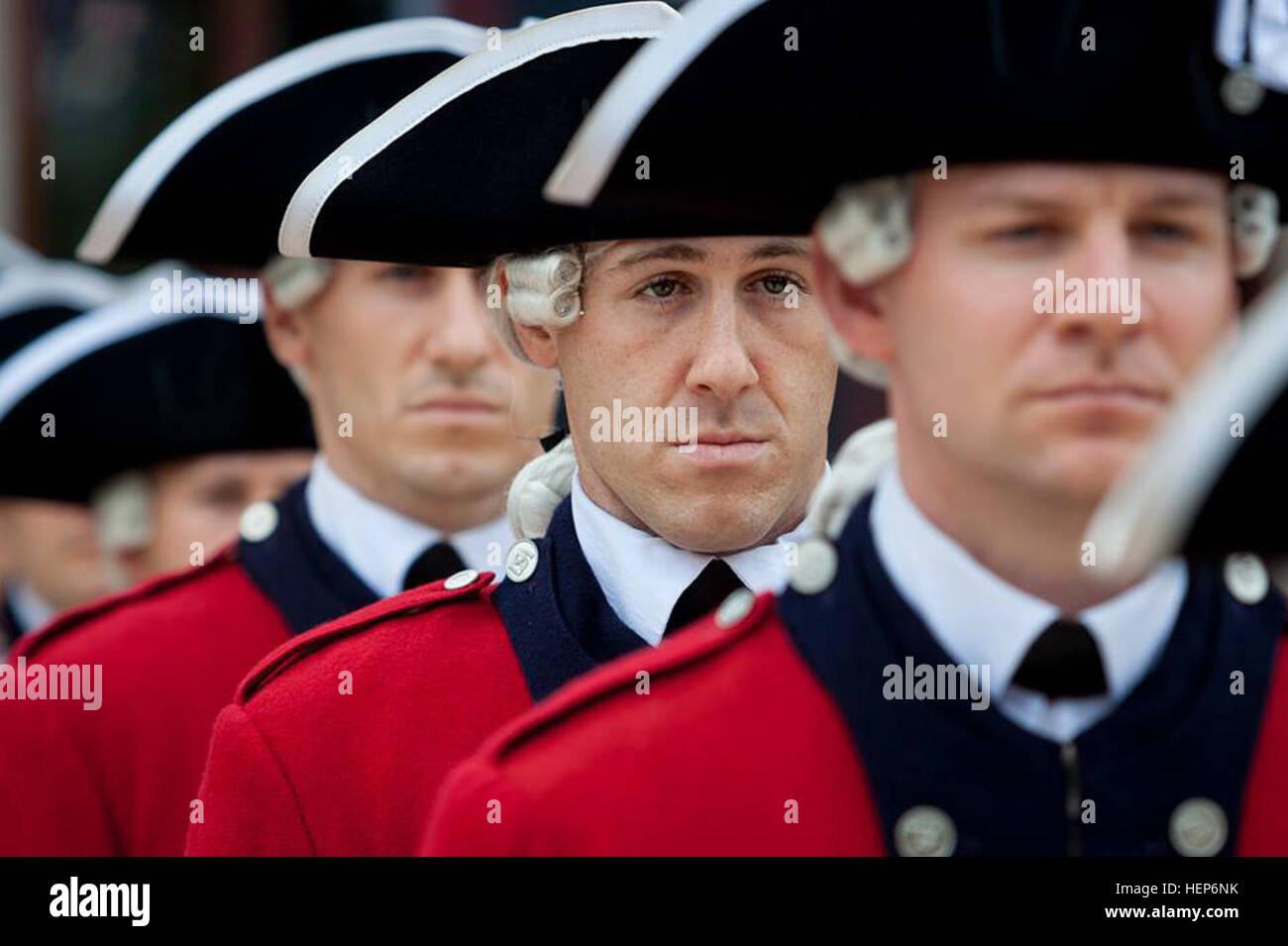 Staff Sgt. William J. Parks, center, a musician with the 3rd U.S. Infantry Regiment (The Old Guard) Fife and Drum Corps, stands at attention during one of the hundreds of performance that FDC conducts annually. Parks became the first Corps musician in recent years to complete the U.S. Army's Air Assault School at Fort Benning, Ga. (U.S. Army photo by Sgt. 1st Class Richard Ruddle) From fife to flight, First fifer pins on air assault badge 150312-A-DZ999-791 Stock Photo