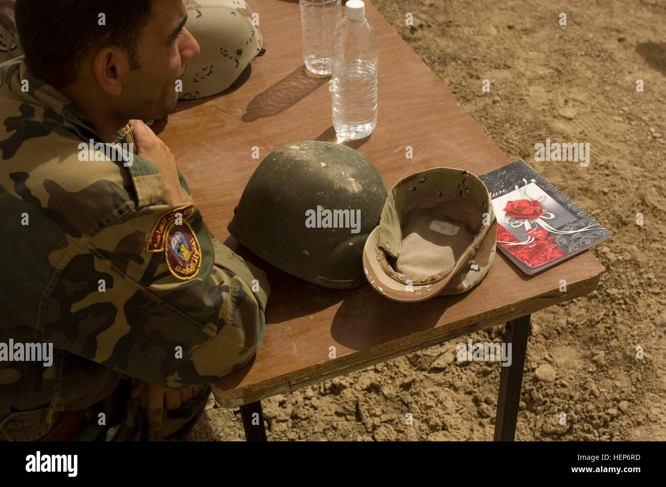 An Iraqi soldier listens during a class on mortars, July 7, on Forward Operating Base Delta. The class was part of a five-day training program undertaken by Georgian soldiers and American military advisers to train soldiers of 1/32 IA Brigade's first and second companies in mortar firing techniques. Georgians train Iraqi mortar teams 102799 Stock Photo