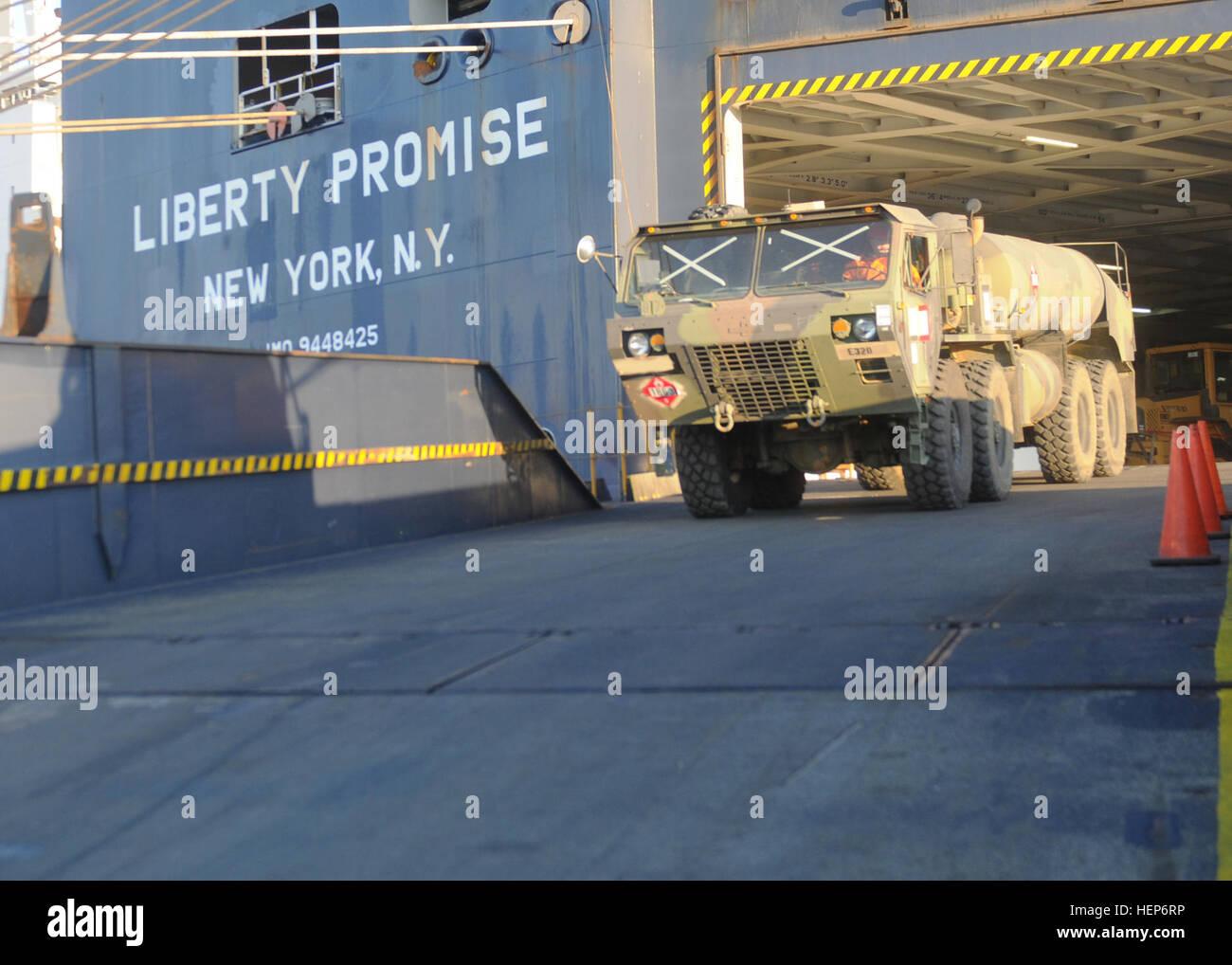 International logisticians offload a U.S. fuel transporter from the