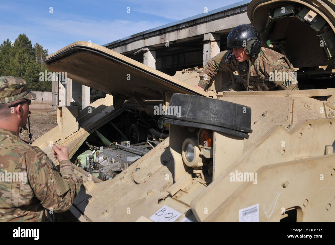 Soldiers of the 2nd Battalion, 7th Infantry Regiment, 1st Armored Brigade Combat Team, 3d Infantry Division out of Fort Stewart, Ga., Readied their equipment upon arrival at Adazi Military Base, Latvia, on March 17, 2015. The unit was  deployed throughout the Baltic region in support of Operation Atlantic Resolve and will be taking over for the 3rd Squadron, 2nd Cavalry Regiment. 1st Brigade, 3rd Infantry Division is the U.S. Army’s current regionally aligned force for Europe. They  will spend the next three months training alongside NATO allies in support of OAR. (U.S. Army photo by Sgt. Aaro Stock Photo