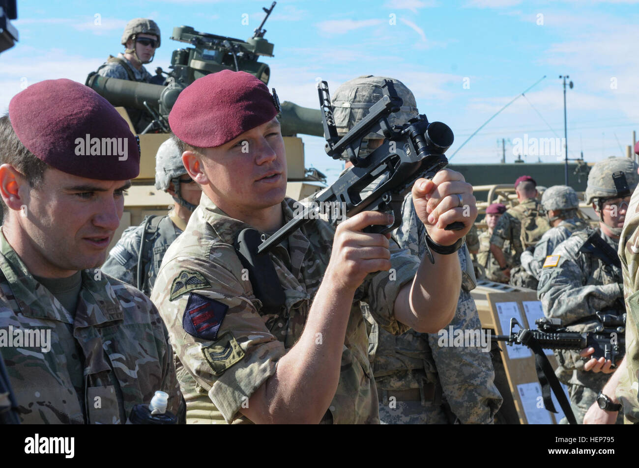 A paratrooper from the British 16 Air Assault Brigade examines an M320 ...