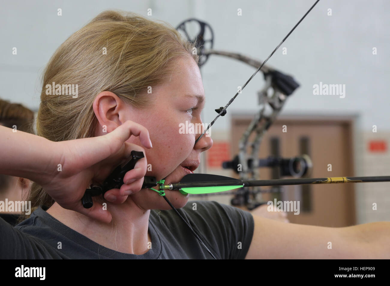 U.S. Army Reserve Spc. Chasity Kuczer, Fort Knox, Ky., takes aim before shooting her bow during
