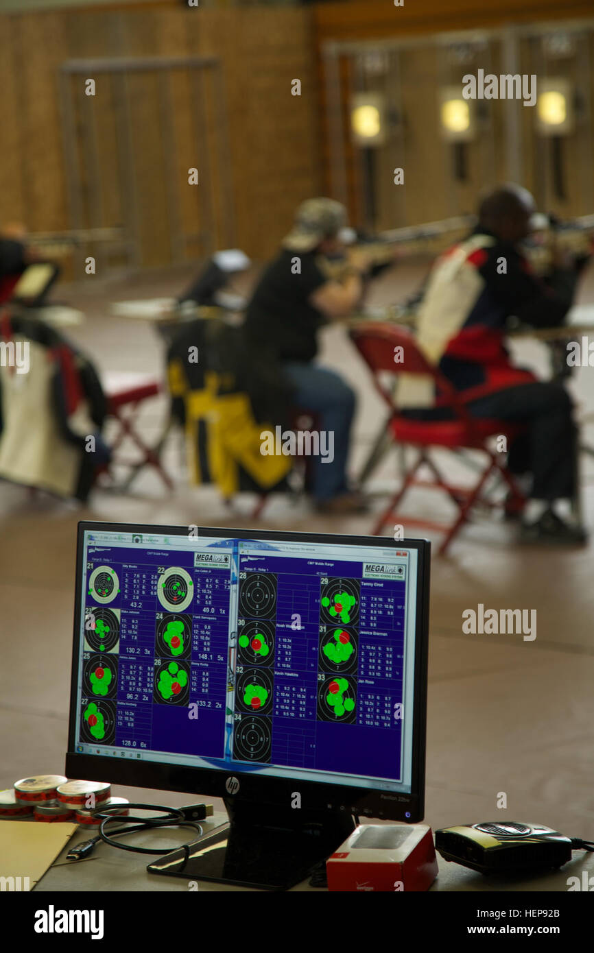 Judges and coaches are able to see immediate results of the shooters' performances with a digital display during the 2015 Army Trials shooting competition at the Milan Physical Fitness Center, Fort Bliss, Texas, March 30, 2015. Approximately 80 wounded, ill and injured Soldiers and veterans are at Fort Bliss to train and compete in a series of athletic events including archery, cycling, shooting, sitting volleyball, swimming, track and field and wheelchair basketball. Army Trials, March 29-April 2, is conducted by the Army Warrior Transition Command and hosted by Fort Bliss. Army Trials help d Stock Photo