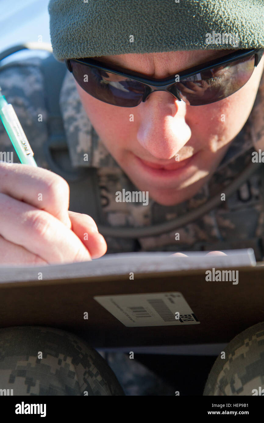 Army Reserve Spc. Chance Humbard, 21, from Waldorf, Maryland, plots his
