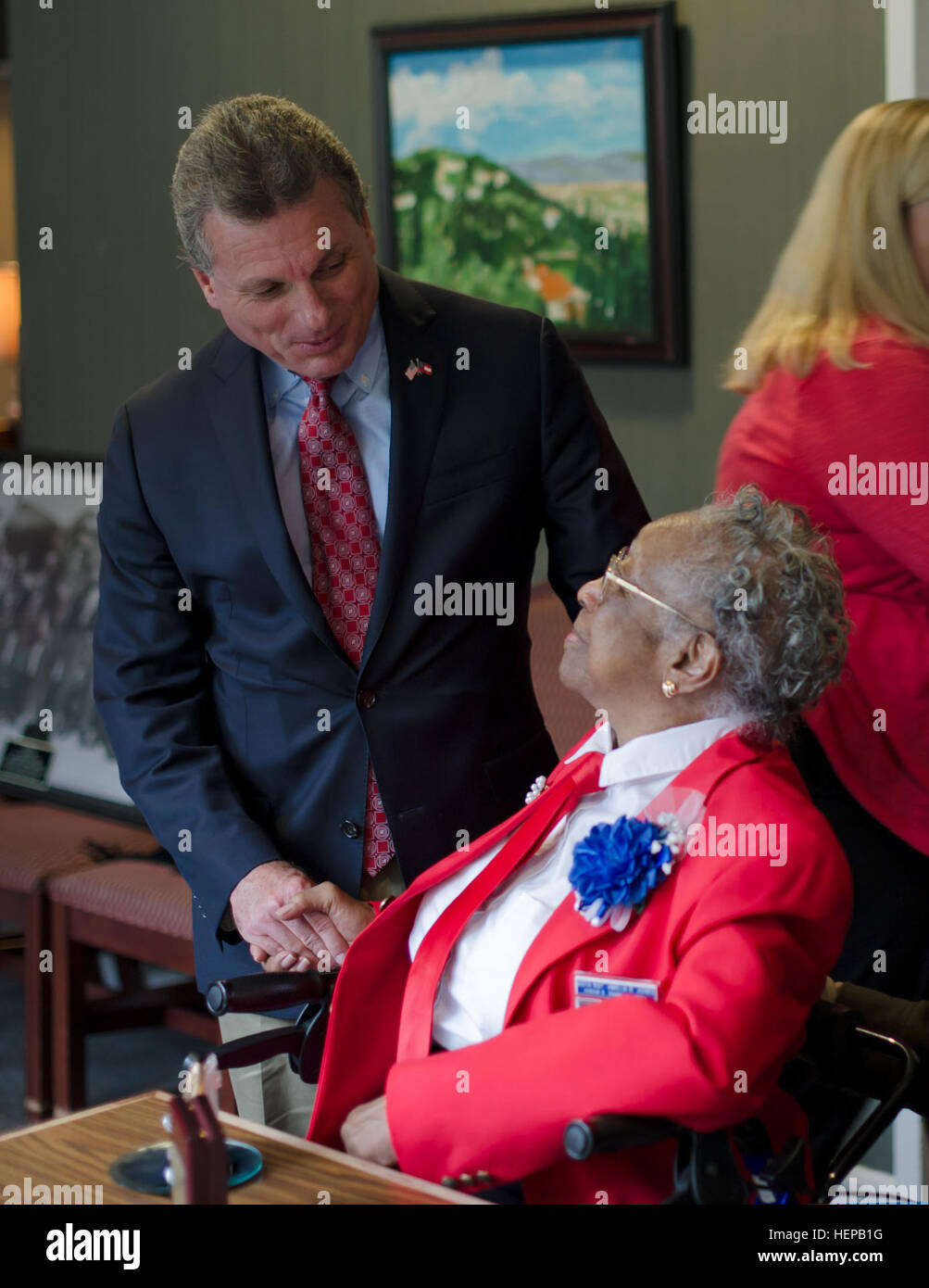 Congressman Earl “Buddy” Carter (GA-01), congratulates Sgt. Amelia Jones, a veteran of the original Tuskegee Airman, at Hospice Savannah, April 19, after she was awarded a bronze replica of the Congressional Gold Medal. Jones, a 95-year-old veteran of the Tuskegee Airmen, was presented her bronze replica of the Congressional Gold Medal by U.S. Sen. Johnny Isakson, R-Ga., along with Brig. Gen. James Blackburn and Command Sgt. Maj. Stanley Varner, command team for Task Force Marne, 3rd Infantry Division. The actual Congressional Gold Medal is one of the two highest civilian awards in the United  Stock Photo