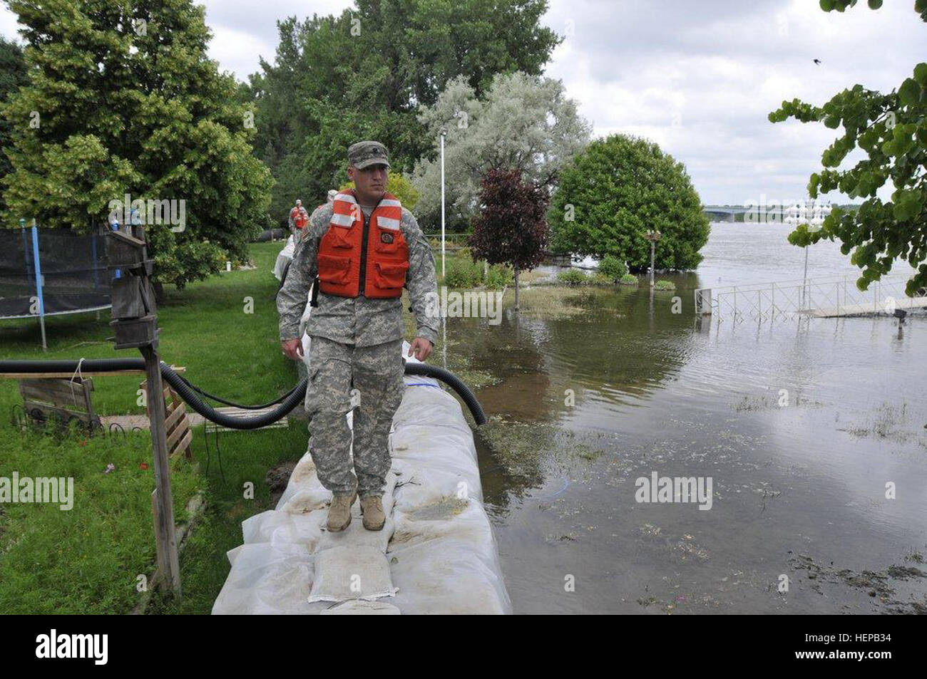 Spc. Sterling Klein, Lemmon, S.D., Det. 2 191st Military Police Company, patrols a dike on the