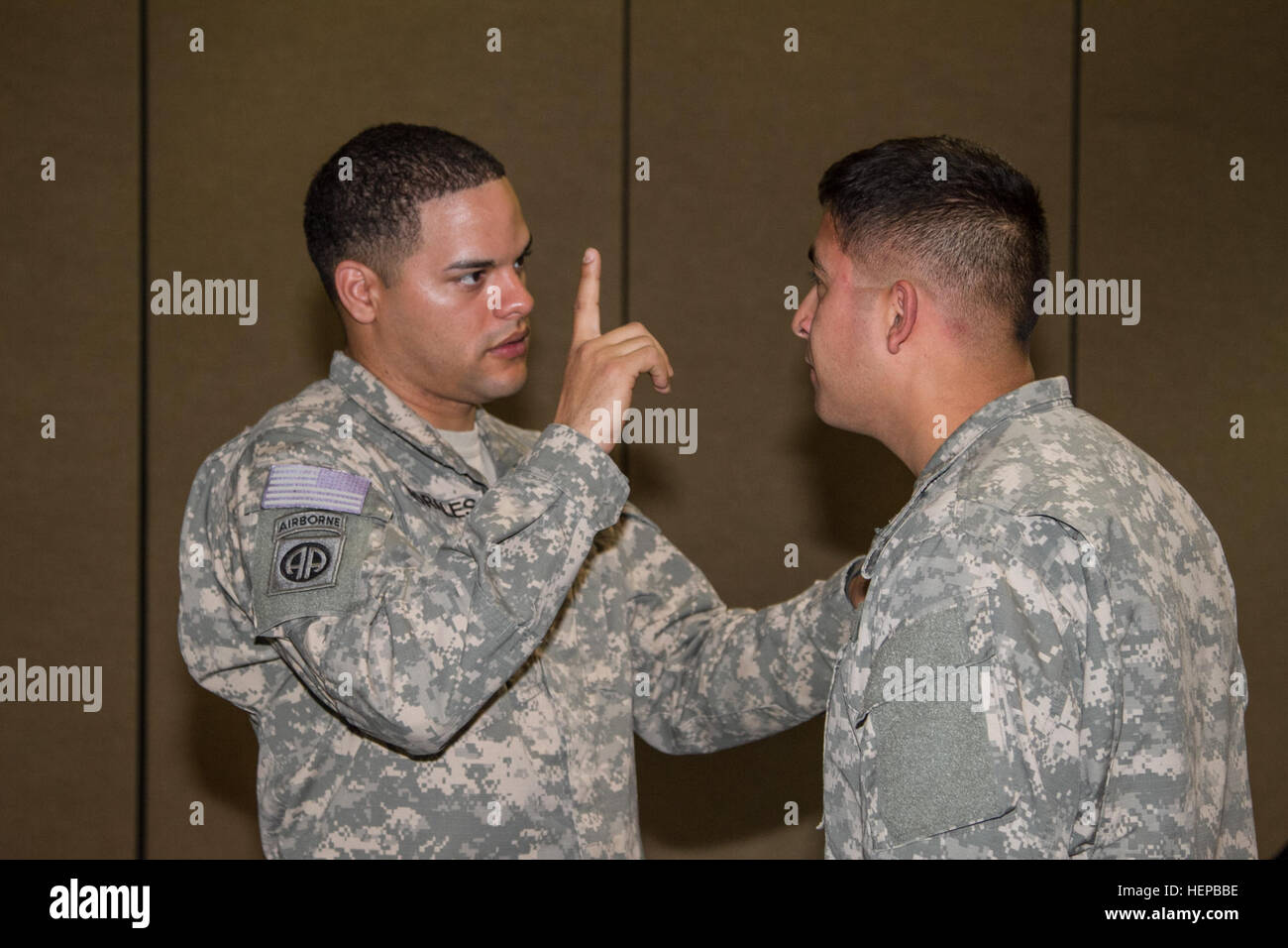 A Soldier from the 2nd Combat Aviation Brigade checks a trainee after he is done fighting April 22, at the Super Gym on Camp Humphreys. They had to make sure the trainees were OK to continue after certain parts of the training. Ready to fight tonight 042215-A-TU438-003 Stock Photo