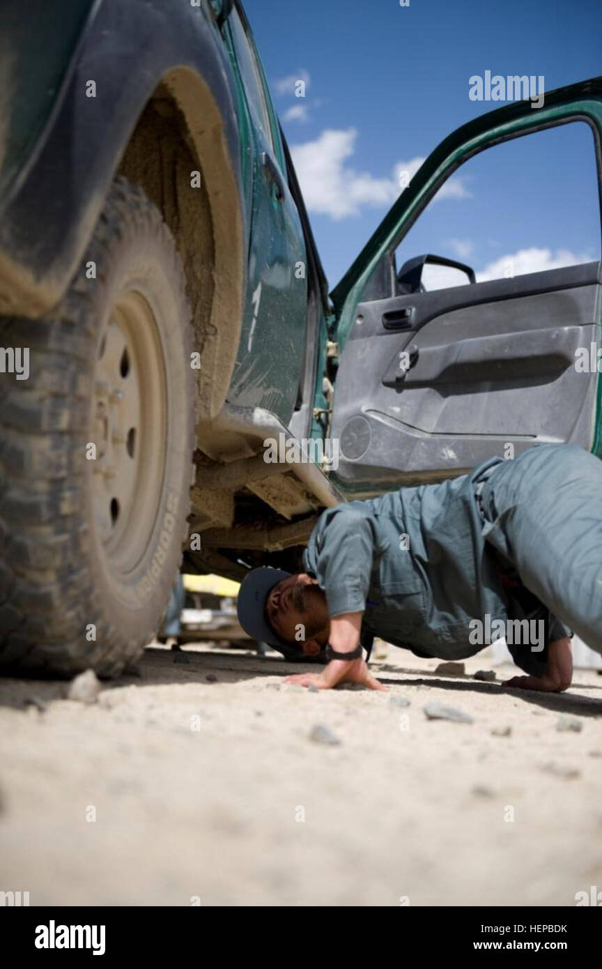 Polish army Warrant Officer Matthew Cegielski, center, advises Afghan