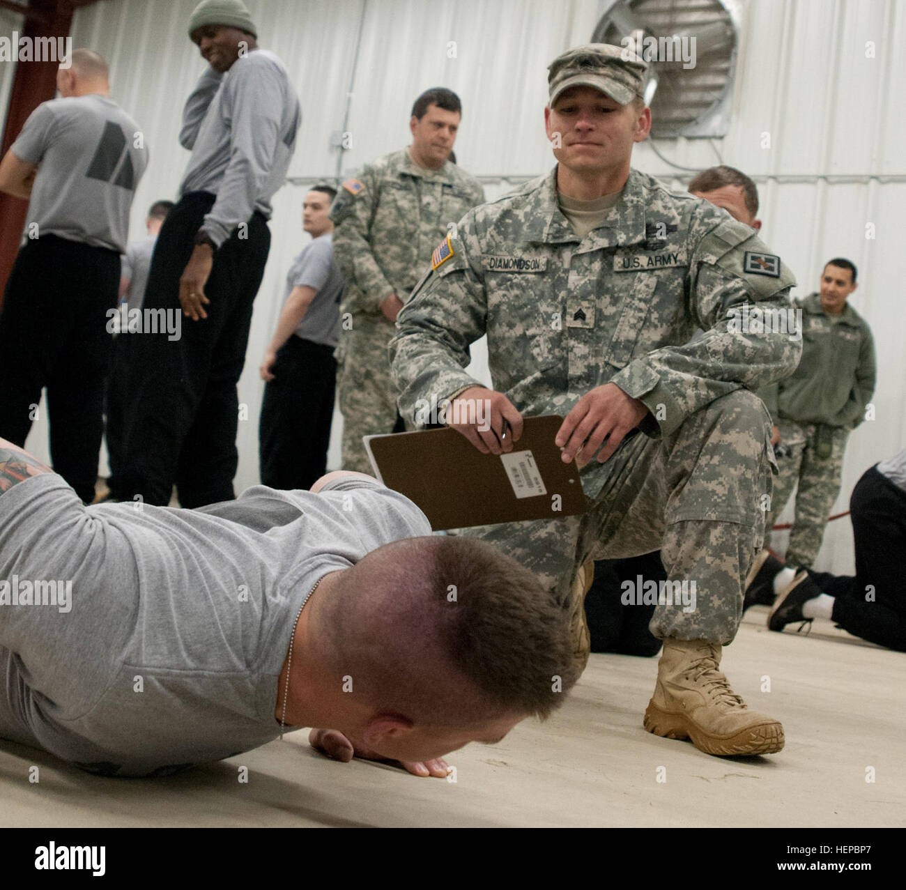 A Soldier from the 416th Theater Engineer Command performs pushups ...