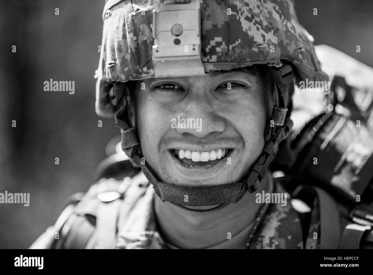 Spc. Jason Pangelinan, with the 9th Mission Support Command, stands for a portrait after finishing a 10-kilometer foot march in the North Carolina heat May 5 during the 2015 Army Reserve Best Warrior Competition at Fort Bragg. This year's Best Warrior Competition will determine the top noncommissioned officer and junior enlisted Soldier who will represent the Army Reserve in the Department of the Army Best Warrior Competition later this year at Fort Lee, Va. (U.S. Army photo by Sgt. 1st Class Michel Sauret) 2015 Army Reserve Best Warrior Competition 150505-A-TI382-658 Stock Photo