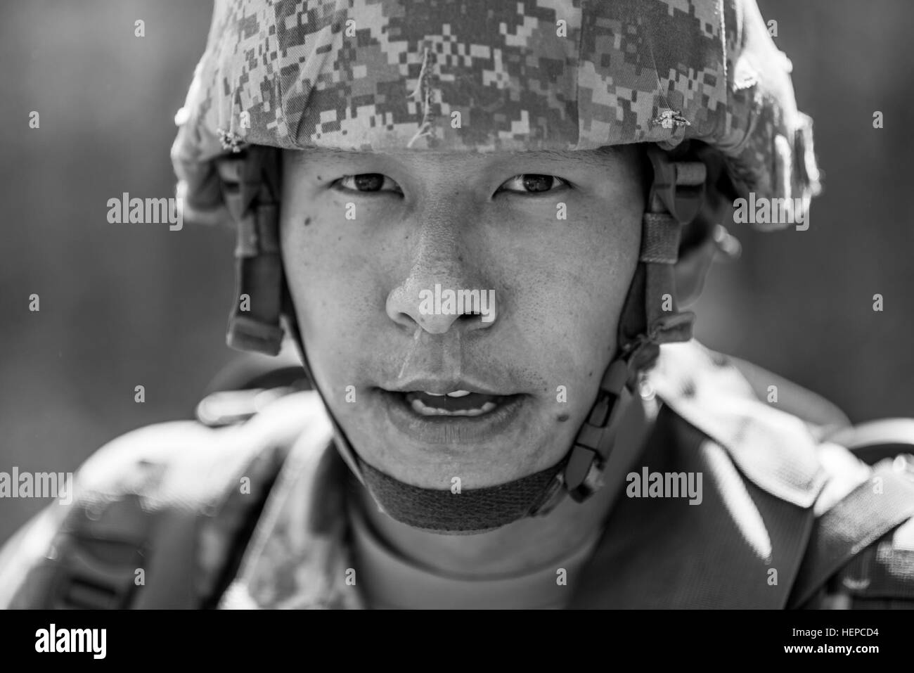 Sgt. Andrew Song, with the Military Intelligence Readiness Command, stands for a portrait after finishing a 10-kilometer foot march in the North Carolina heat May 5 during the 2015 Army Reserve Best Warrior Competition at Fort Bragg. This year's Best Warrior Competition will determine the top noncommissioned officer and junior enlisted Soldier who will represent the Army Reserve in the Department of the Army Best Warrior Competition later this year at Fort Lee, Va. (U.S. Army photo by Sgt. 1st Class Michel Sauret) 2015 Army Reserve Best Warrior Competition 150505-A-TI382-949 Stock Photo