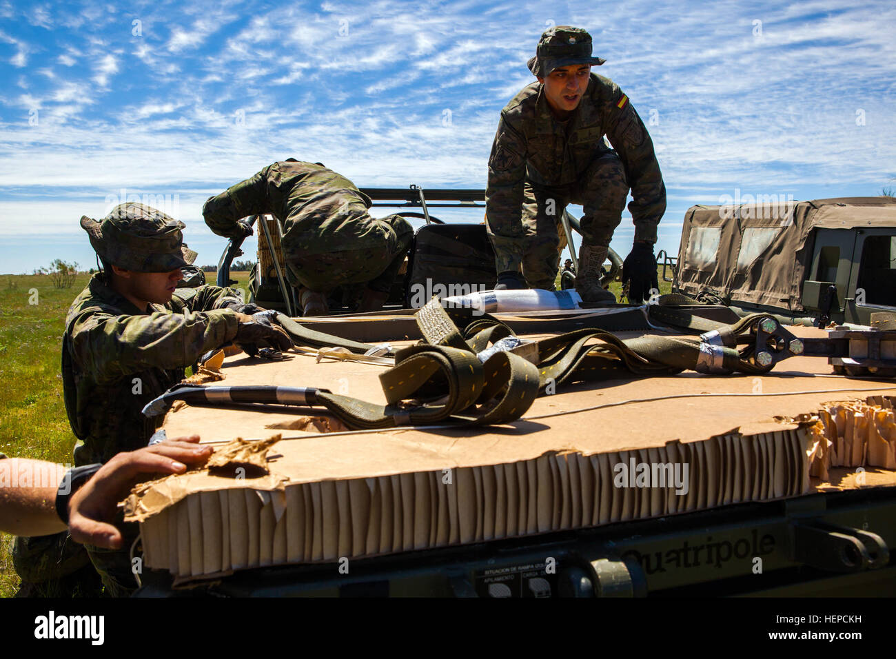 Spanish Soldiers from the Brigada Paracaidista recover a transport vehicle following an airborne cargo drop during Operation Skyfall - España, Madrid, Spain, May 7, 2015.  Operation Skyfall - España is an exercise initiated and organized by the 982nd Combat Camera Company, and hosted by the Brigada Paracaidista of the Spanish army. The exercise is a bilateral subject matter exchange focusing on interoperability of combat camera training and documentation of airborne operations. (U.S. Army photo by Staff Sgt. Justin P. Morelli / Released) Operation Skyfall - Espa%%%%%%%%C3%%%%%%%%B1a 150507-A-P Stock Photo