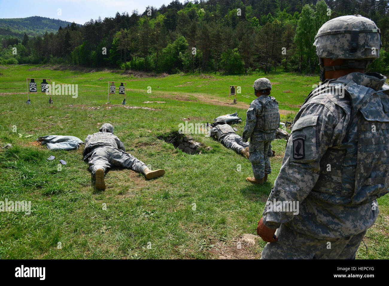 U.S. Army paratroopers assigned to the 173rd Airborne Brigade Support Battalion engage targets with an M4 carbine from the prone position during weapons qualification at Pocek Range in Postonja, Slovenia, May 14, 2015. The brigade is in Slovenia for Neptune Thrust, a combined exercise between the 173rd Airborne Brigade and Slovenian soldiers focused on enhancing interoperability and developing individual technical skills. (U.S. Army photo by Visual Information Specialist Davide Dalla Massara/Released) Neptune Thrust 2015 150514-A-DO858-497 Stock Photo