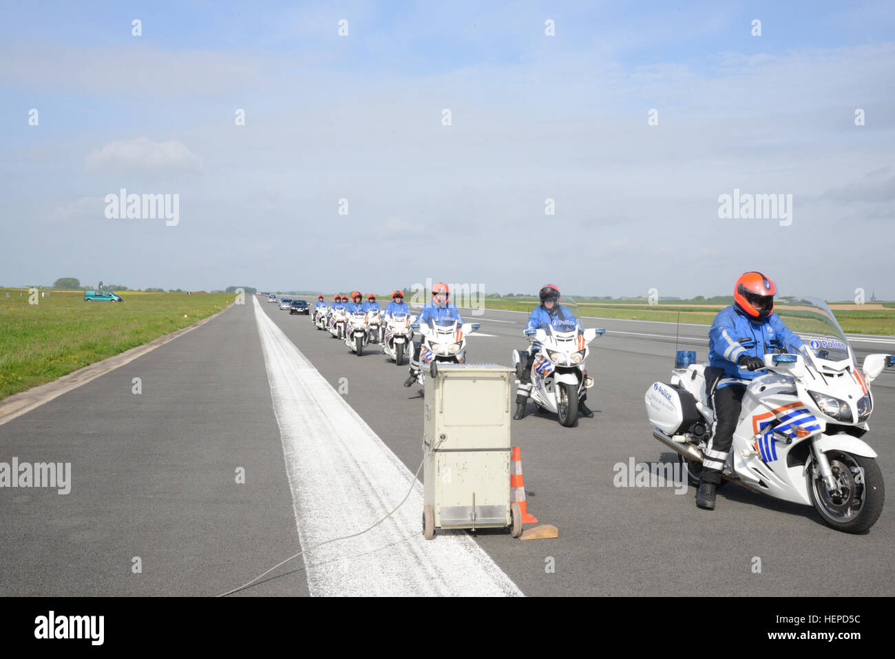 Team of Belgian Federal Police Patrol motorbikes, passes in order of convoy in front of the speed radar and this several times at increasing speeds in Chièvres, Belgium, May 18, 2015. The Hainaut Province Road Police installed its speed radar in order to check the accuracy of the speedometers of federal police patrol cars, motorbikes and unmarked cars, local police patrol cars, and U.S. Army Military Police patrol cars. (U.S. Army photo by Visual Information Specialist Pascal Demeuldre-Released) Belgian Police, US Military Police calibrate speedometers on Chi%%%%%%%%C3%%%%%%%%A8vres Air Base's Stock Photo