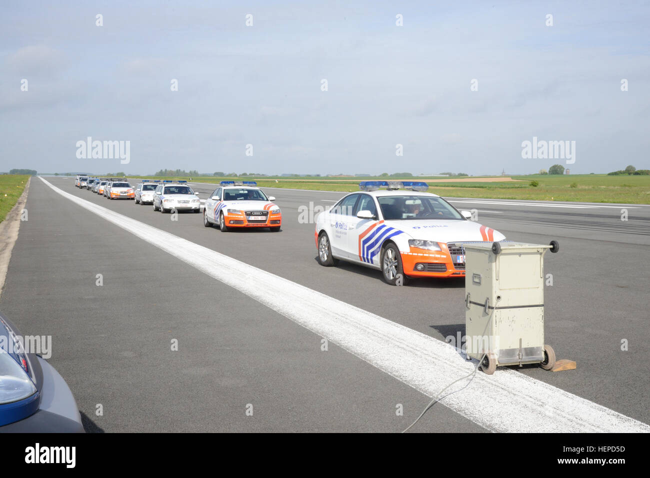 Team of Belgian Federal Police Patrol Cars, passes in order of convoy in front of the speed radar and this several times at increasing speeds, in Chièvres, Belgium, May 18, 2015. The Hainaut Province Road Police installed its speed radar in order to check the accuracy of the speedometers of Federal Police patrol cars, motorcycles and unmarked cars, Local Police patrol cars, and U.S. Army Military Police patrol cars. (U.S. Army photo by Visual information Specialist Pascal Demeuldre-Released) Belgian Police, US Military Police calibrate speedometers on Chi%%%%%%%%C3%%%%%%%%A8vres Air Base's air Stock Photo