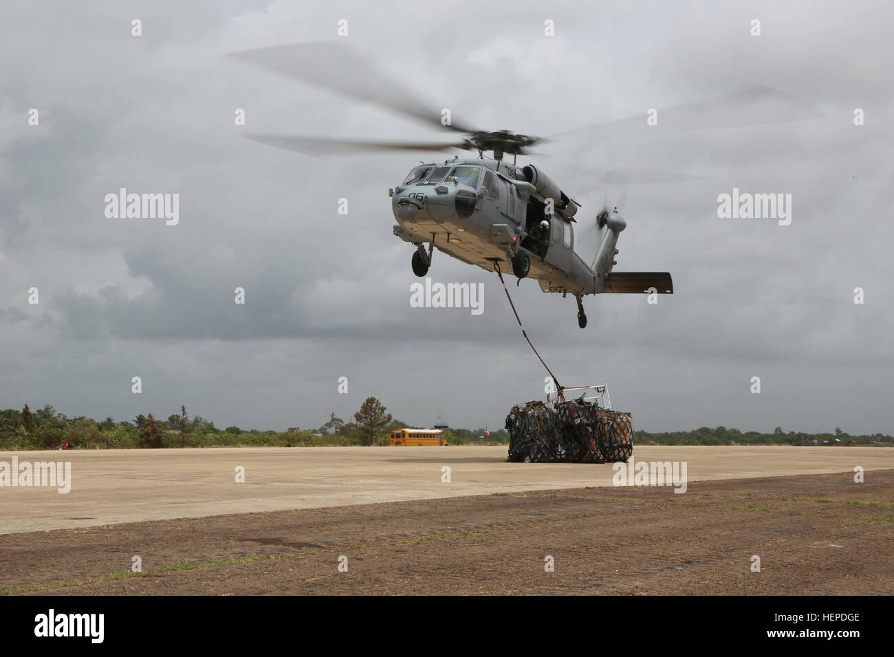150522-A-BK746-233 PUERTO CABEZAS, Nicaragua (May 22, 2015) - An MH-60s Sea Hawk helicopter assigned to Helicopter Sea Combat Squadron (HSC) 22 Sea Knights, delivers donations during flight operations in support of Continuing Promise 2015. Continuing Promise is a U.S. Southern Command-sponsored and U.S. Naval Forces Southern Command/U.S. 4th Fleet-conducted deployment to conduct civil-military operations including humanitarian-civil assistance, subject matter expert exchanges, medical, dental, veterinary and engineering support and disaster response to partner nations and to show U.S. support  Stock Photo
