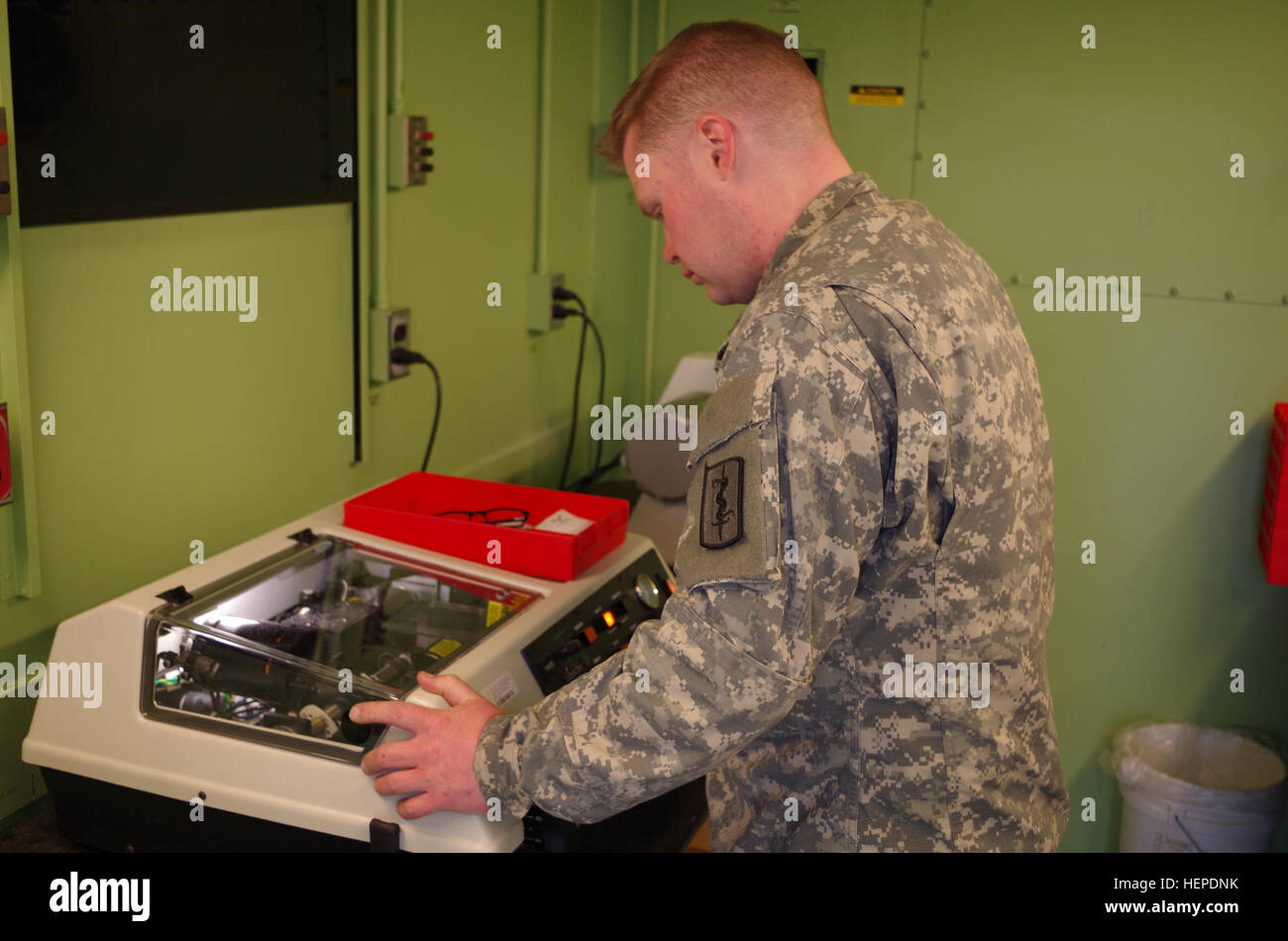 Medical Edging Sample Medical logistics Soldiers use an edging machine to cut and shape ...