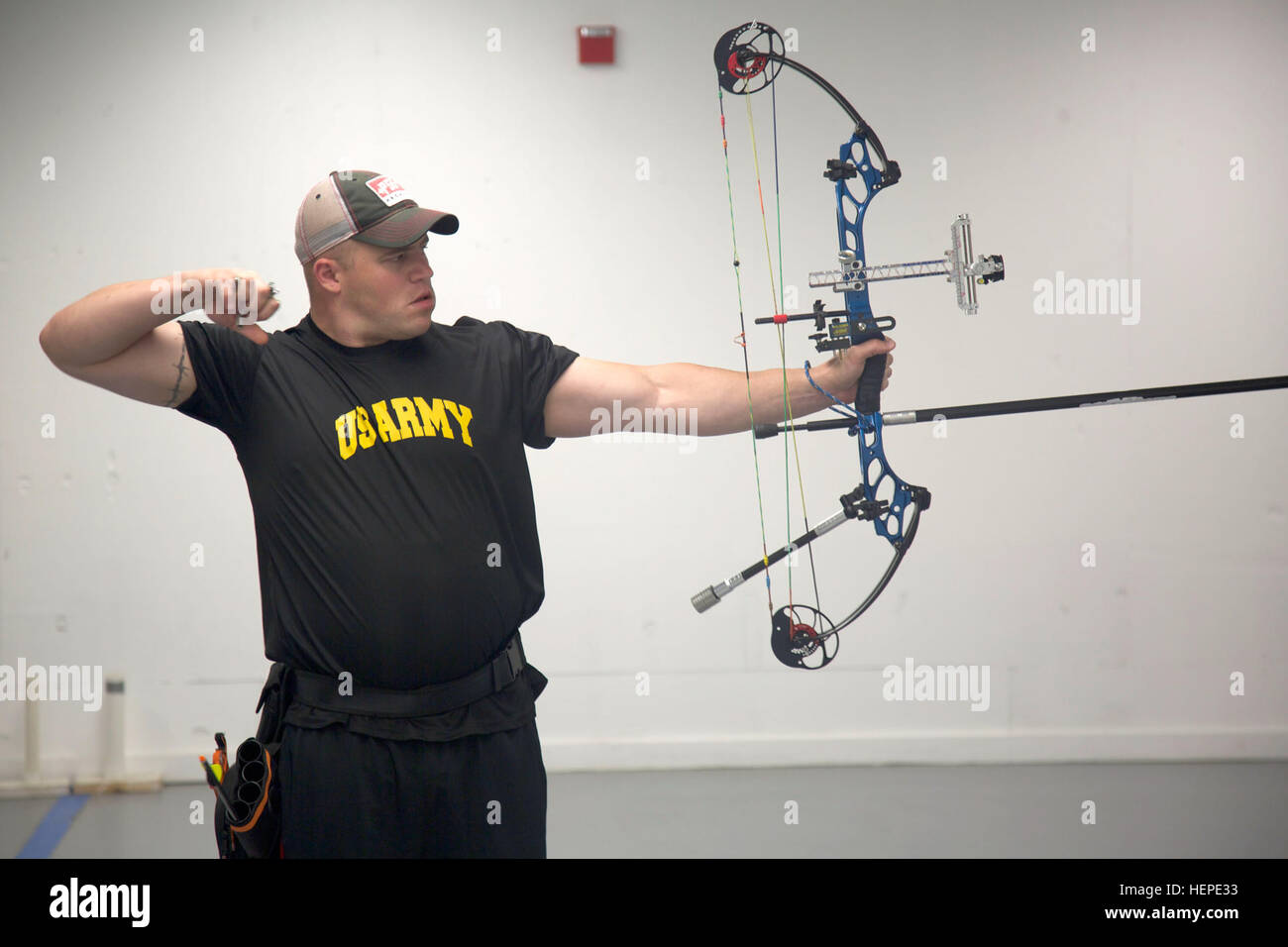U.S. Army Reserves Sgt. Colten Harms, assigned to Fort Riley Warrior Transition Unit, follows through his release during archery training for the 2015 Department of Defense Warrior Games at Fort Belvoir, Va., June 4, 2015. Harms is one of more than 40 active duty and veteran athletes training at Fort Belvoir to represent Team Army in the DoD Warrior Games held at Marine Corps Base, Quantico, Va., June 19-28. The 2015 DoD Warrior Games is an adaptive sports competition for wounded, ill and injured service members and veterans. Approximately 250 athletes, representing teams from the Army, Marine Stock Photo