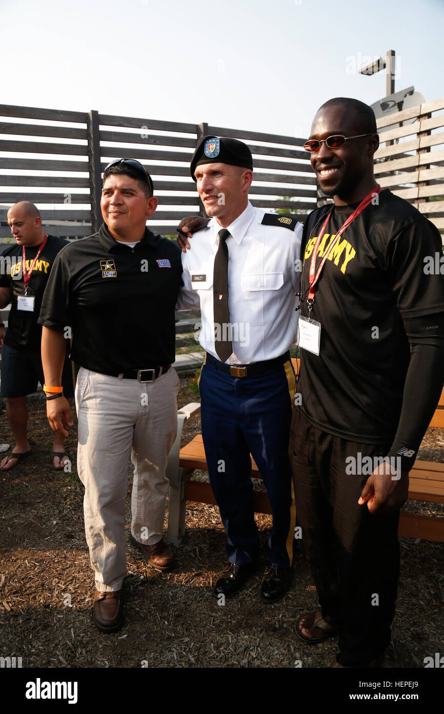 U.S. Army Sgt. Maj. of the Army, Daniel A. Dailey, Chief Warrant Officer 3 Timothy Sifuentes, (left), and Sgt. Zedrik Pitts,(right), pose for a photo, at Fort Belvoir, Virginia, June 10, 2015. More than 40 active duty and veteran athletes train at Fort Belvoir to represent Team Army in the DOD Warrior Games held at Marine Corps Base, Quantico, Virginia, June 19-28. The 2015 DOD Warrior Games is an adaptive sports competition for wounded, ill and injured service members and veterans. Approximately 250 athletes, representing teams from the Army, Marine Corps, Navy, Air Force, Special Operations  Stock Photo