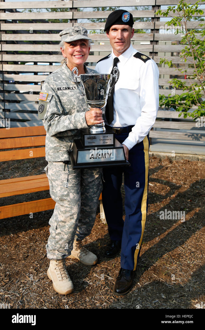 U.S. Army Sgt. Maj. of the Army, Daniel A. Dailey, and U.S. Army Col. Victoria Kilcawley, Adaptive Reconditioning Program, Warrior Transition Command, hold the 2014 Chairman's Cup for a photo at Fort Belvoir, Virginia, June 10, 2015. More than 40 active duty and veteran athletes train at Fort Belvoir to represent Team Army in the DOD Warrior Games held at Marine Corps Base, Quantico, Virginia, June 19-28. The 2015 DOD Warrior Games is an adaptive sports competition for wounded, ill and injured service members and veterans. Approximately 250 athletes, representing teams from the Army, Marine Co Stock Photo
